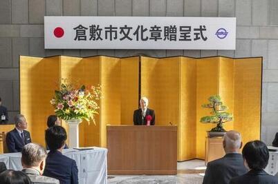 写真：挨拶をする佐藤道郎氏